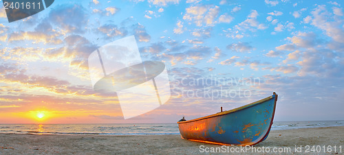 Image of Fishing boat and sunrise