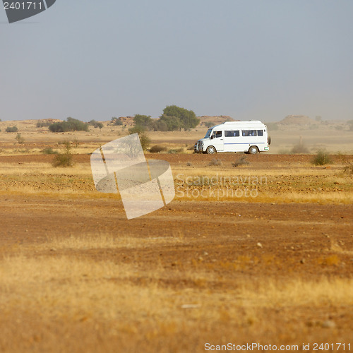 Image of Bus carries tourists to the rocky desert. India