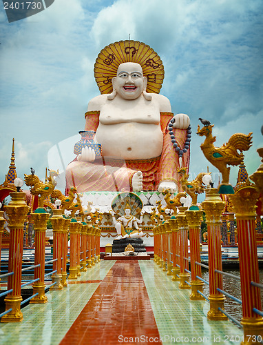 Image of Big laughing Buddha statue. Wat Plai Laem, Samui, Thailand