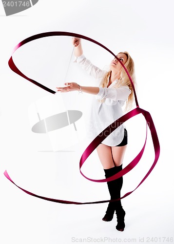 Image of rhythmic gymnastics woman with red tape