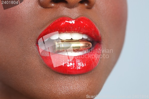 Image of Lips of a Woman With A Bullet and Smoke