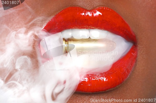 Image of Lips of a Woman With A Bullet and Smoke