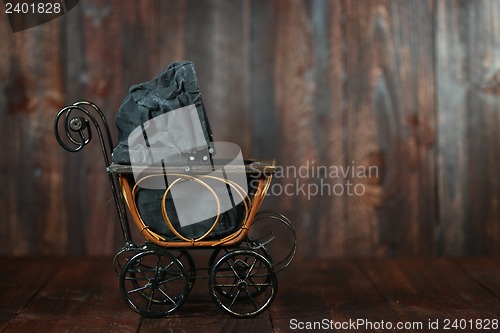 Image of Baby Cradle on Grunge Wooden Background