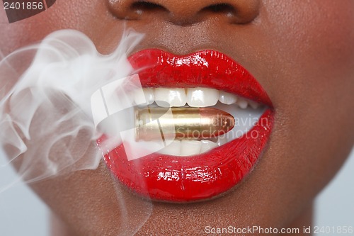 Image of Lips of a Woman With A Bullet and Smoke