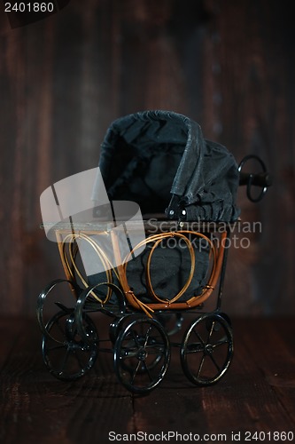 Image of Baby Cradle on Grunge Wooden Background