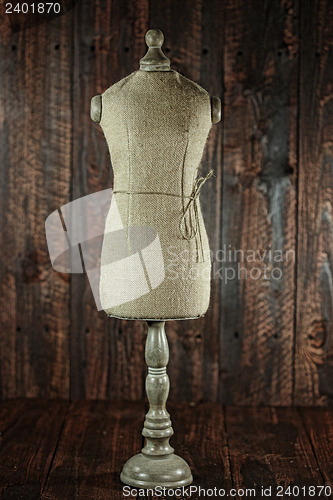 Image of Antique Mannequin Busts on Wood Grunge Background