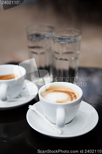 Image of Two cups of coffee and water