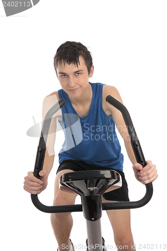 Image of Teenage boy using an exercise bike fitness