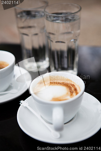 Image of Two cups of coffee and water