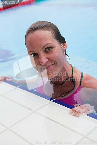 Image of Female swimmer at pool edge