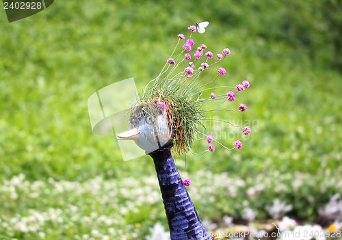 Image of Sculpture of birds in flowers