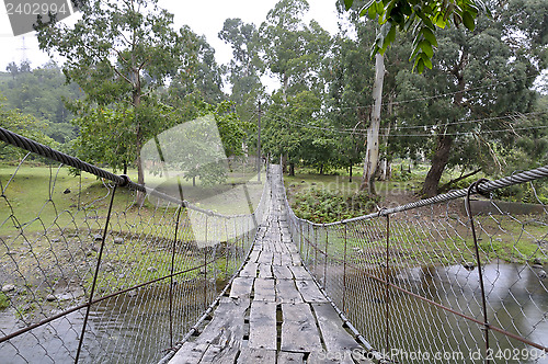 Image of rope bridge over the river