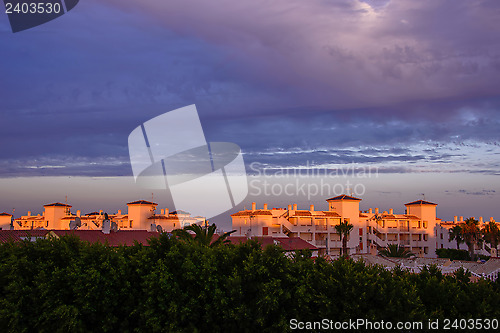 Image of Sunset over properties