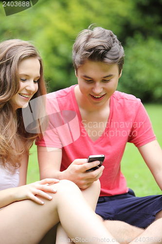 Image of Happy young teenage boy and girl
