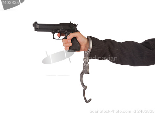 Image of Businessman with gun and handcuffs