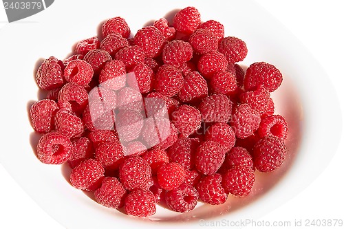 Image of Raspberries on a plate over white