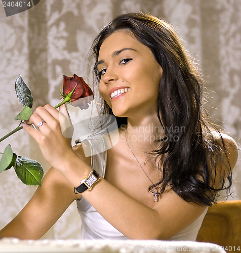 Image of laughing girl with rose