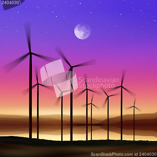 Image of wind turbines at night