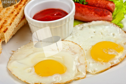 Image of Fried eggs with sausages