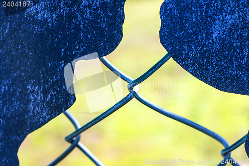 Image of hole in a fence