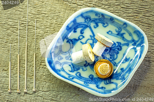 Image of acupuncture needles and moxibustion cones