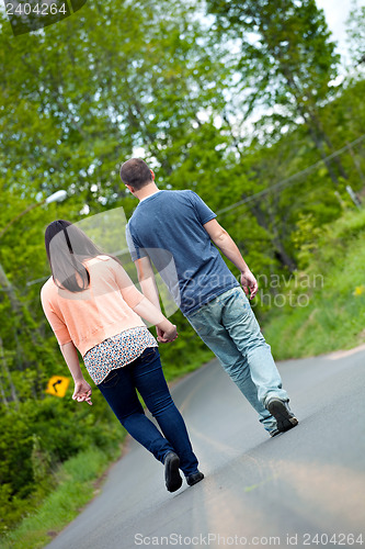 Image of Man and Woman Walking in Street