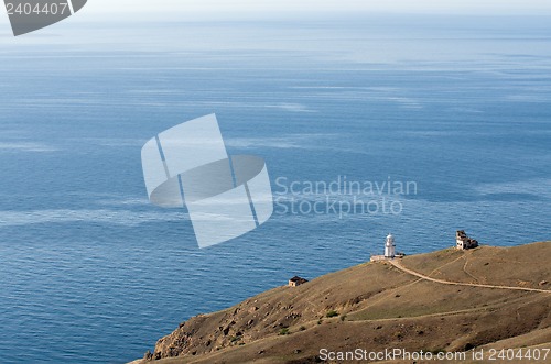 Image of View to sea and lighthouse building