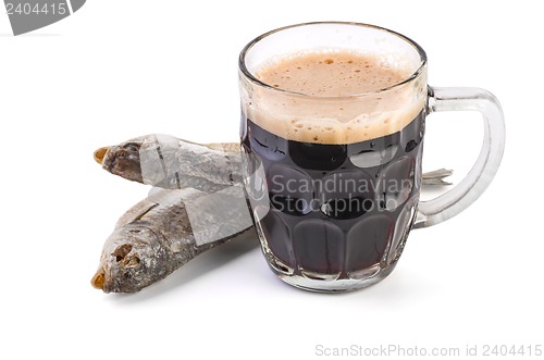 Image of Glass mug with brown ale and dried fish