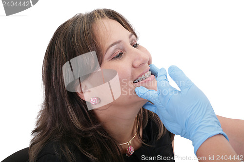 Image of Female patient looking treating at her dentist