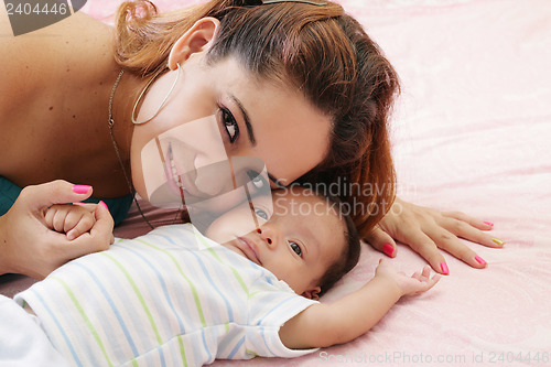 Image of Portrait of happy woman with her baby 