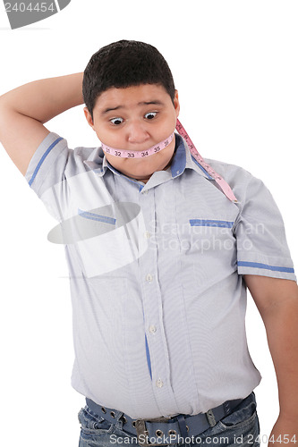 Image of Fat boy with a measuring tape.  Its time to diet