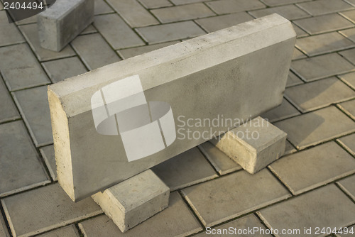 Image of One large curb stone is made of concrete