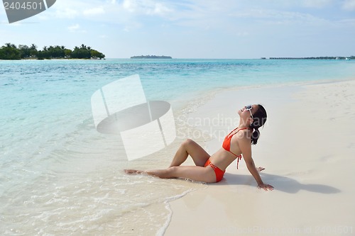Image of beautiful girl on beach have fun