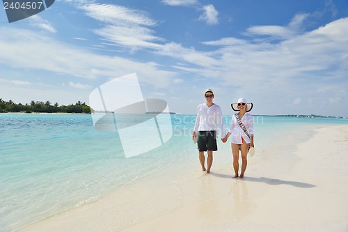 Image of happy young couple have fun on beach