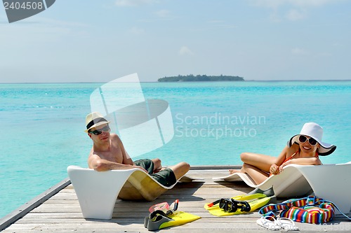 Image of happy young couple have fun on beach