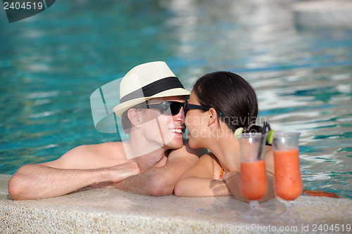 Image of happy young couple relax and take fresh drink