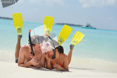 Image of happy young couple have fun on beach