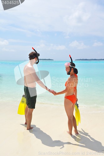 Image of happy young couple have fun on beach
