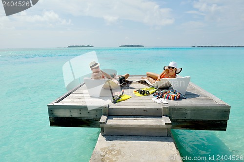 Image of happy young couple have fun on beach