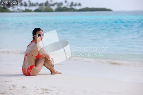 Image of beautiful girl on beach have fun