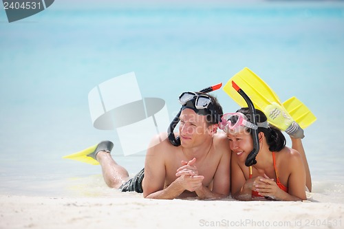 Image of happy young couple have fun on beach