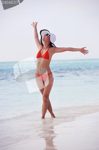 Image of beautiful girl on beach have fun