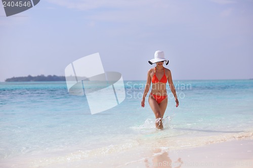Image of beautiful girl on beach have fun