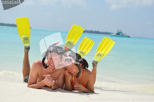Image of happy young couple have fun on beach