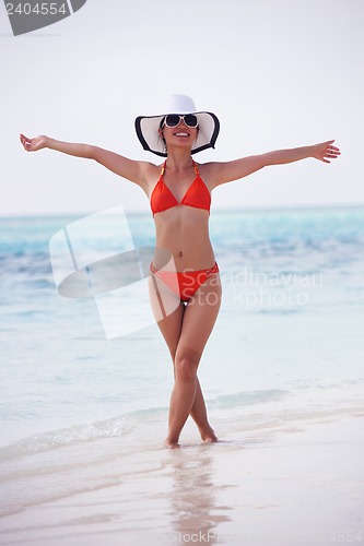Image of beautiful girl on beach have fun