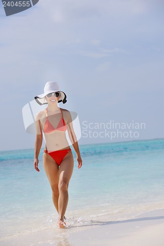 Image of beautiful girl on beach have fun