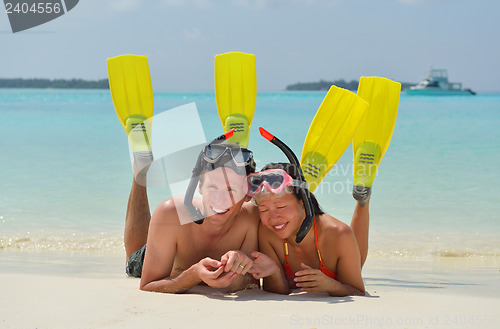 Image of happy young couple have fun on beach