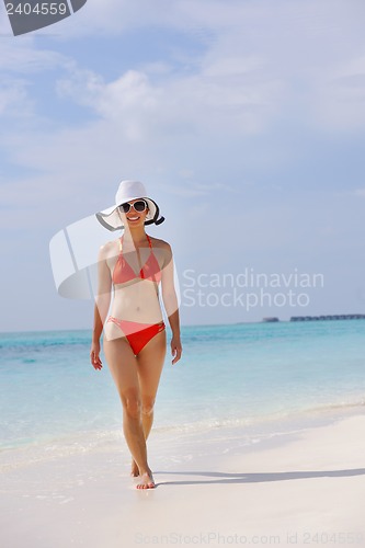 Image of beautiful girl on beach have fun