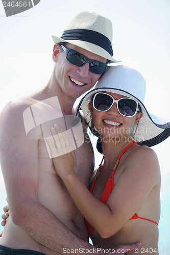 Image of happy young couple have fun on beach