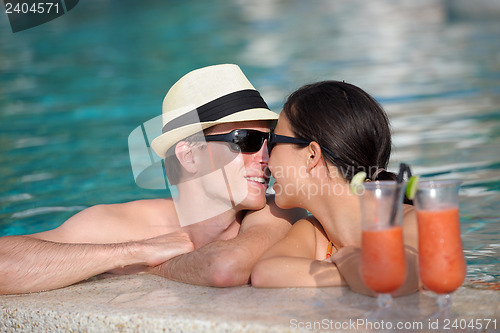 Image of happy young couple relax and take fresh drink